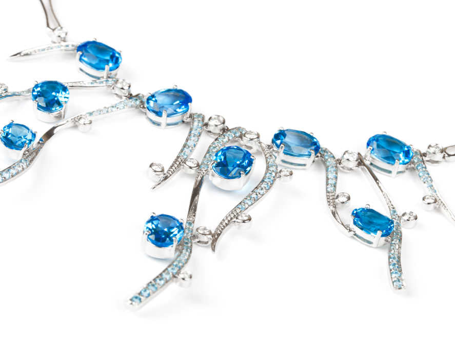 Image by Terekhov igor via Shutterstock - Fashionable necklace with sapphires on a white background