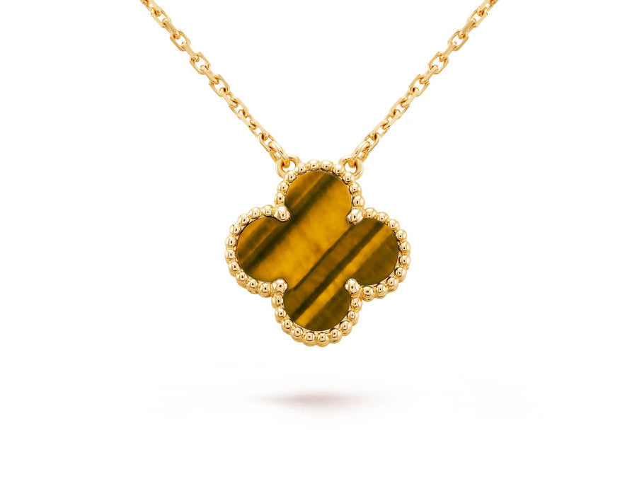 Image via Van Cleef and Arpels - Vintage Alhambra pendant Yellow gold Tiger Eye
