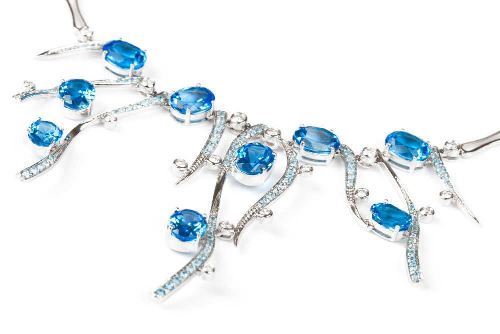 Image by Terekhov igor via Shutterstock - Fashionable necklace with sapphires on a white background