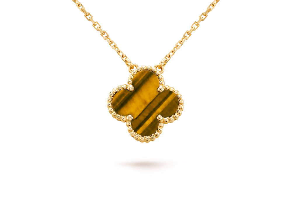 Image via Van Cleef and Arpels - Vintage Alhambra pendant Yellow gold Tiger Eye